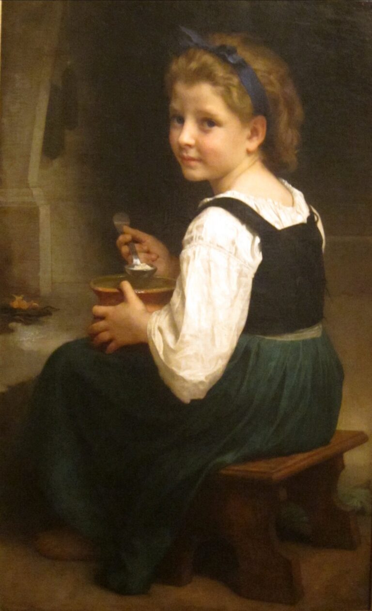 粥を食べる少女